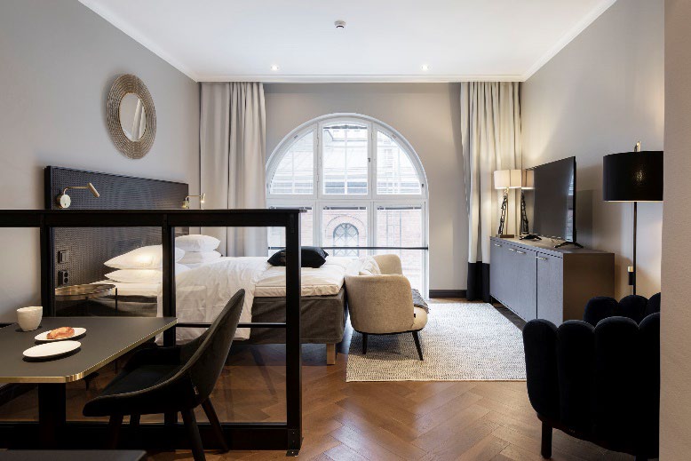 Bob W bedroom — natural light, brick